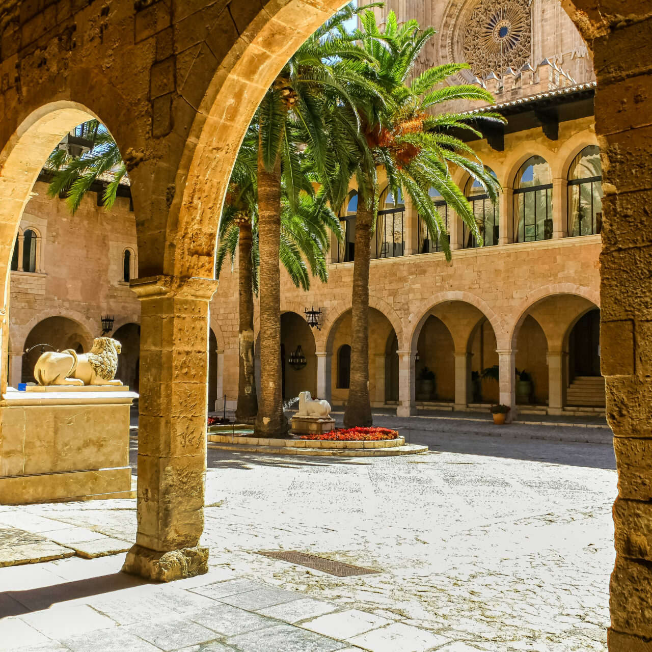 Interior of the cathedral of Mallorca with patio and stone arches.